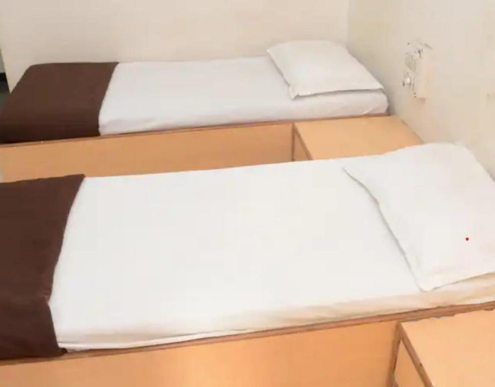 Postel nebo postele na pokoji v ubytování Hotel Rahi