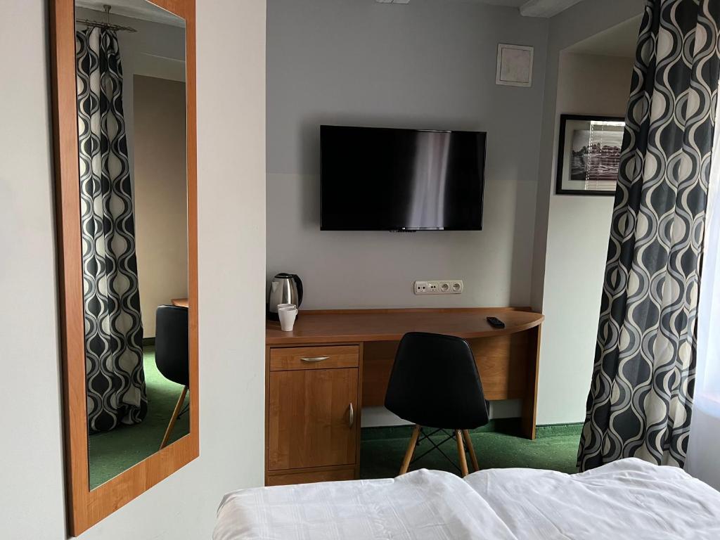 TV a/nebo společenská místnost v ubytování Garbarska 22 Aparthotel