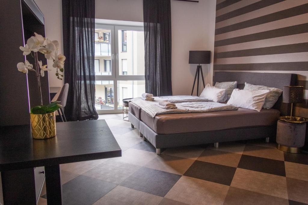 Postel nebo postele na pokoji v ubytování Giessener Bett