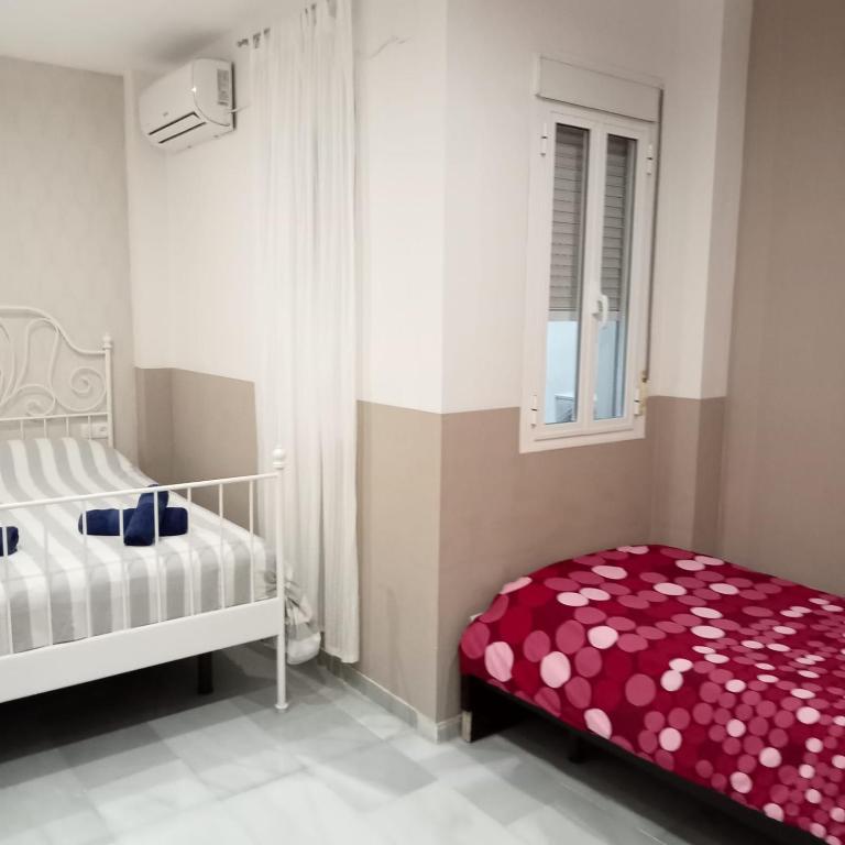 Posteľ alebo postele v izbe v ubytovaní Apartamentos centro histórico