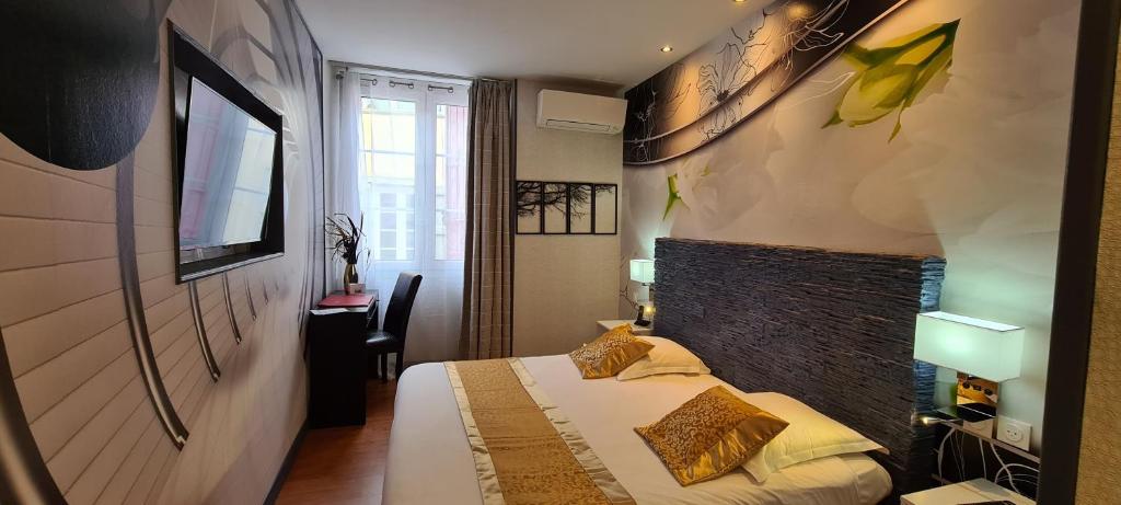 Letto o letti in una camera di Hôtel Renaissance