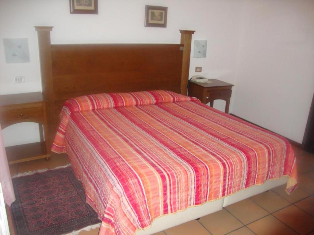 Postel nebo postele na pokoji v ubytování Hotel Cristal