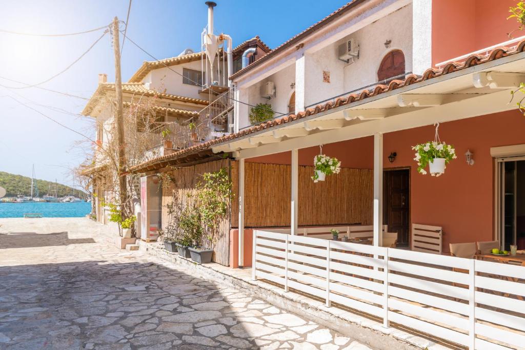 a house on the side of a street at Τrilogy Studios in Syvota