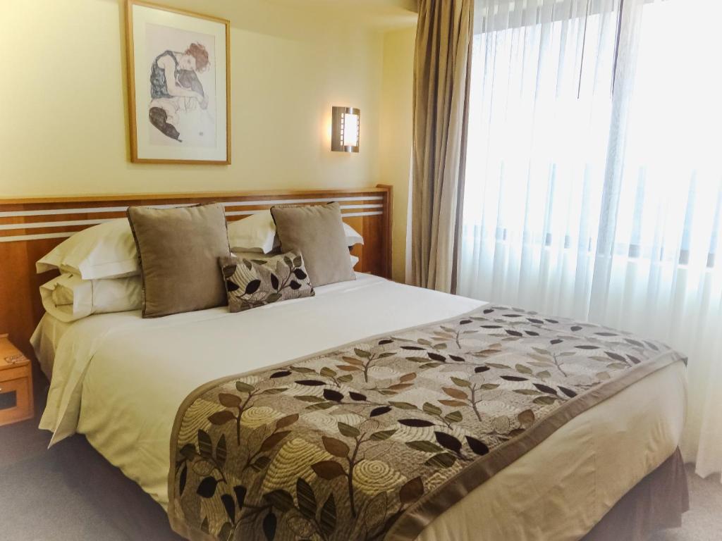 Voodi või voodid majutusasutuse Hotel Restaurante Ankara toas