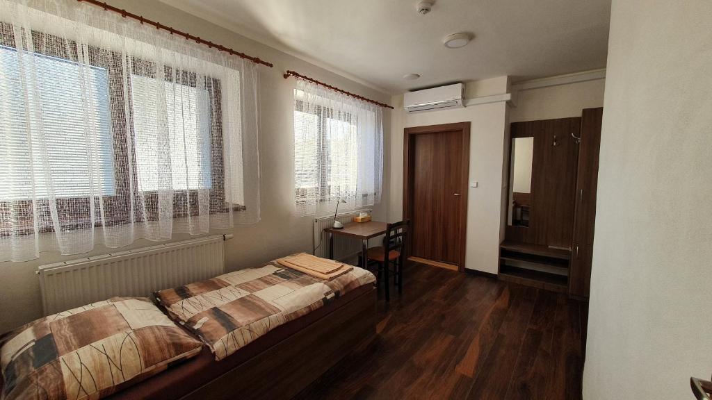 Postel nebo postele na pokoji v ubytování Motorest U Kola