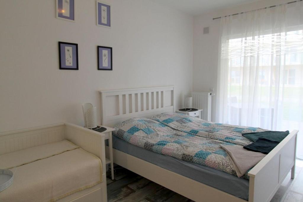 Postel nebo postele na pokoji v ubytování Velence Spa Lake Apartman