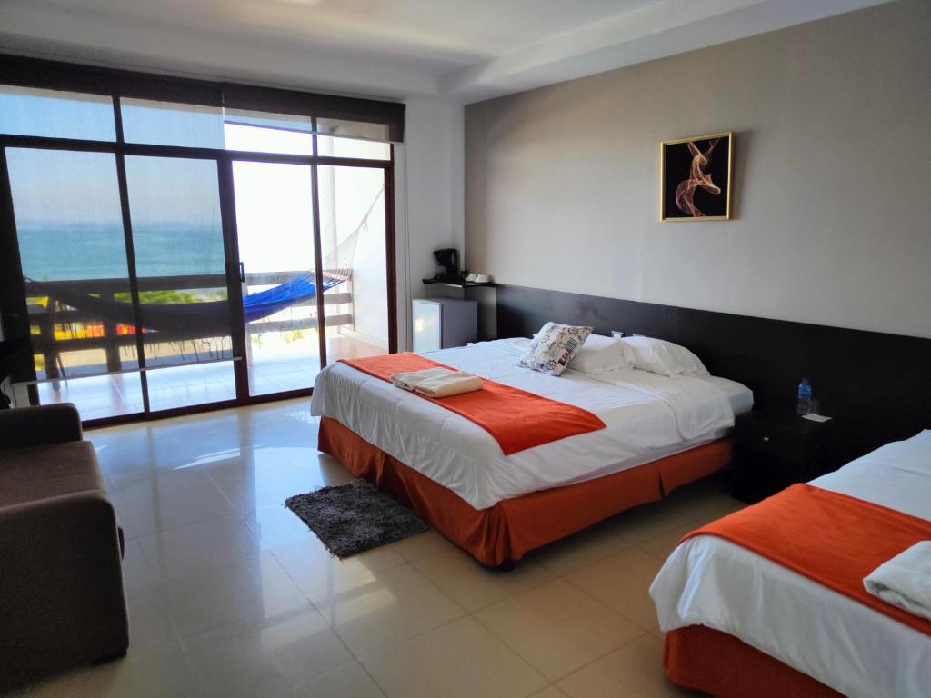 Postel nebo postele na pokoji v ubytování Hotel Punta Azul