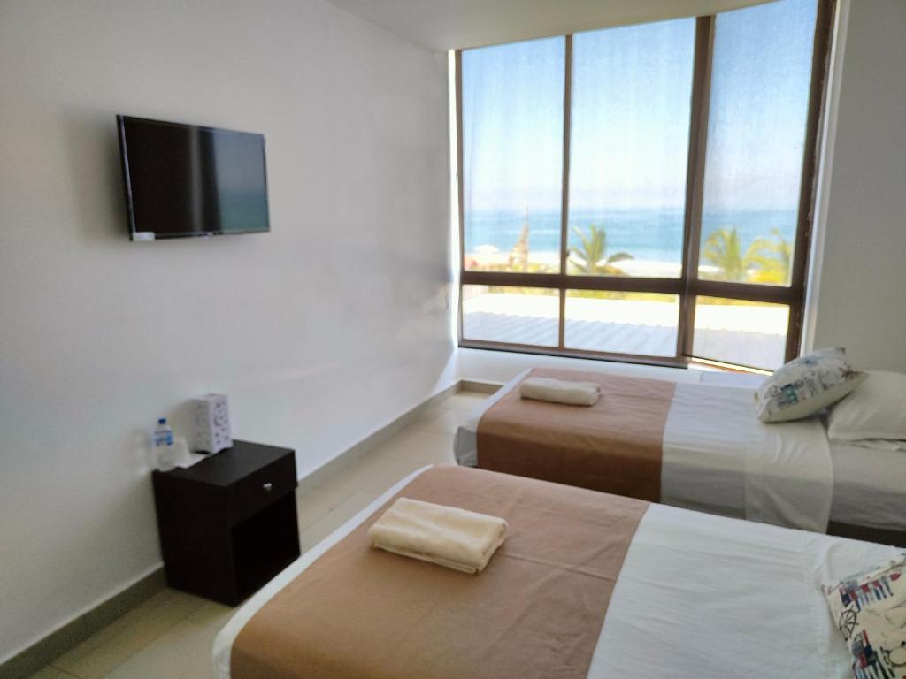 Postel nebo postele na pokoji v ubytování Hotel Punta Azul