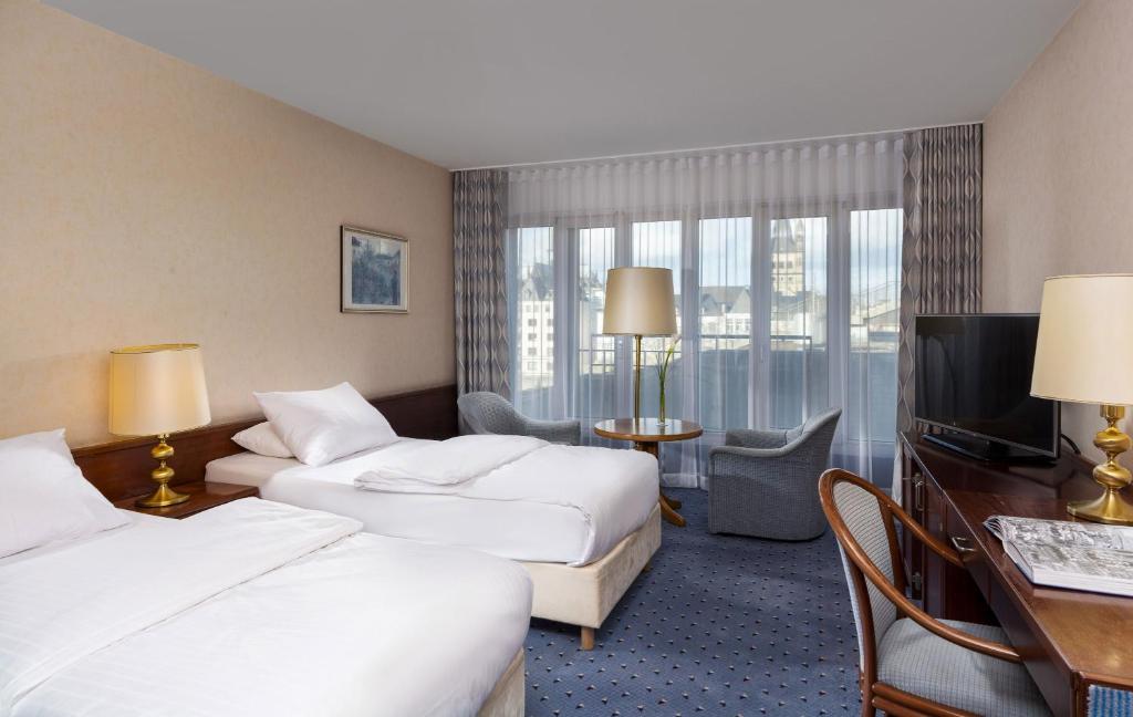 Postel nebo postele na pokoji v ubytování Maritim Hotel Köln