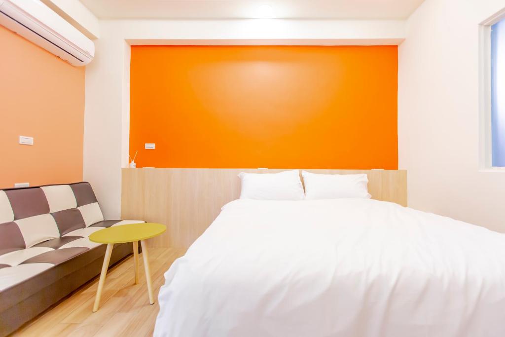 Postel nebo postele na pokoji v ubytování WOW Penghu Homestay