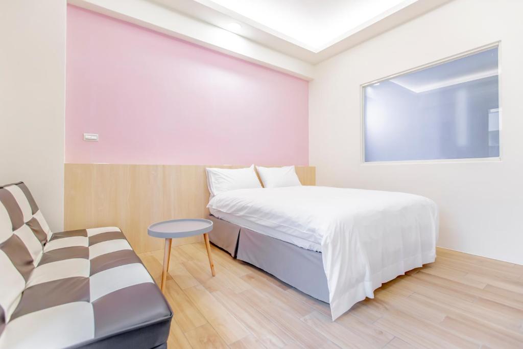 Postel nebo postele na pokoji v ubytování WOW Penghu Homestay