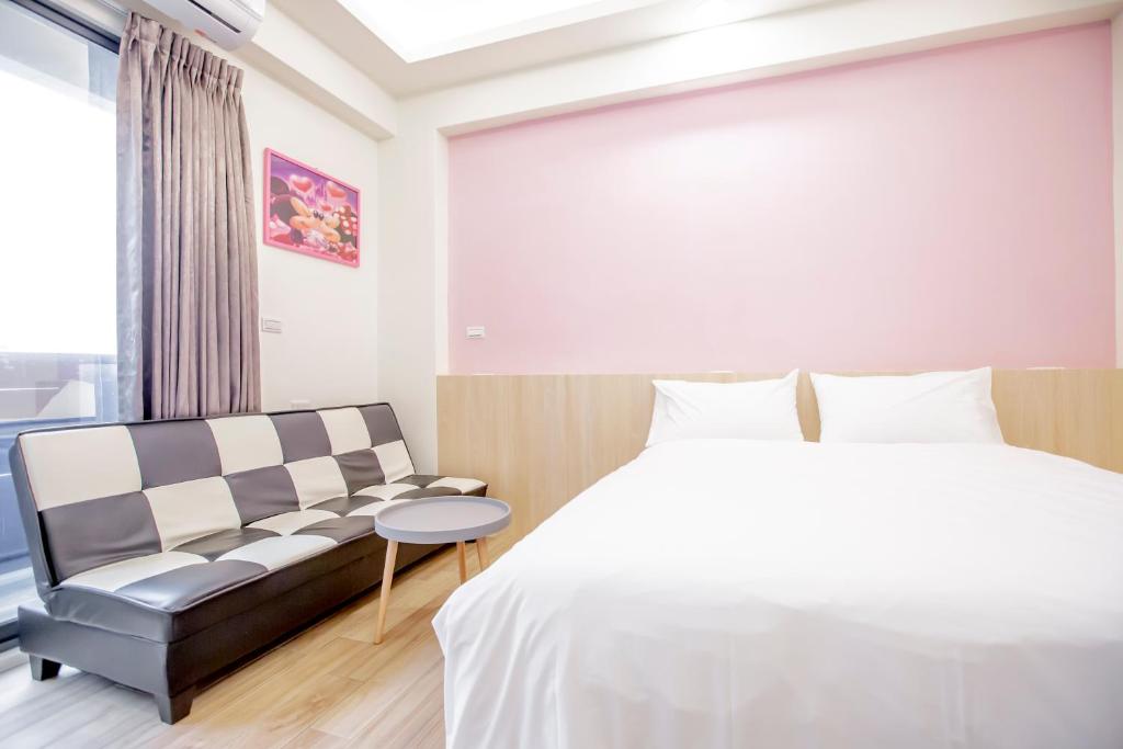 Postel nebo postele na pokoji v ubytování WOW Penghu Homestay