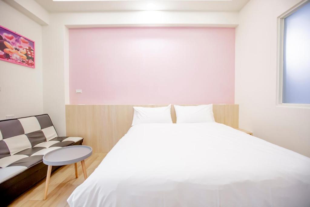 Postel nebo postele na pokoji v ubytování WOW Penghu Homestay