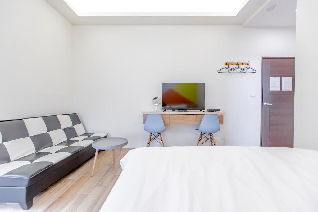 Postel nebo postele na pokoji v ubytování WOW Penghu Homestay