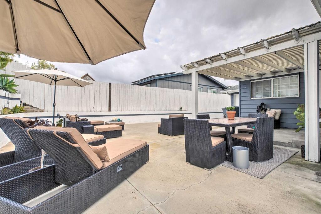a patio with a table and chairs and an umbrella at Relaxing Poway Abode Near Parks and Wineries! in Poway