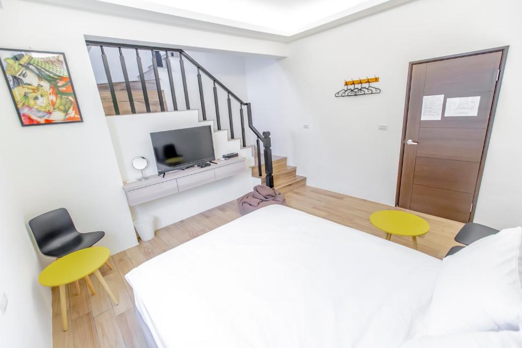 Postel nebo postele na pokoji v ubytování WOW Penghu Homestay