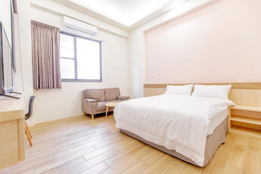 Postel nebo postele na pokoji v ubytování WOW Penghu Homestay