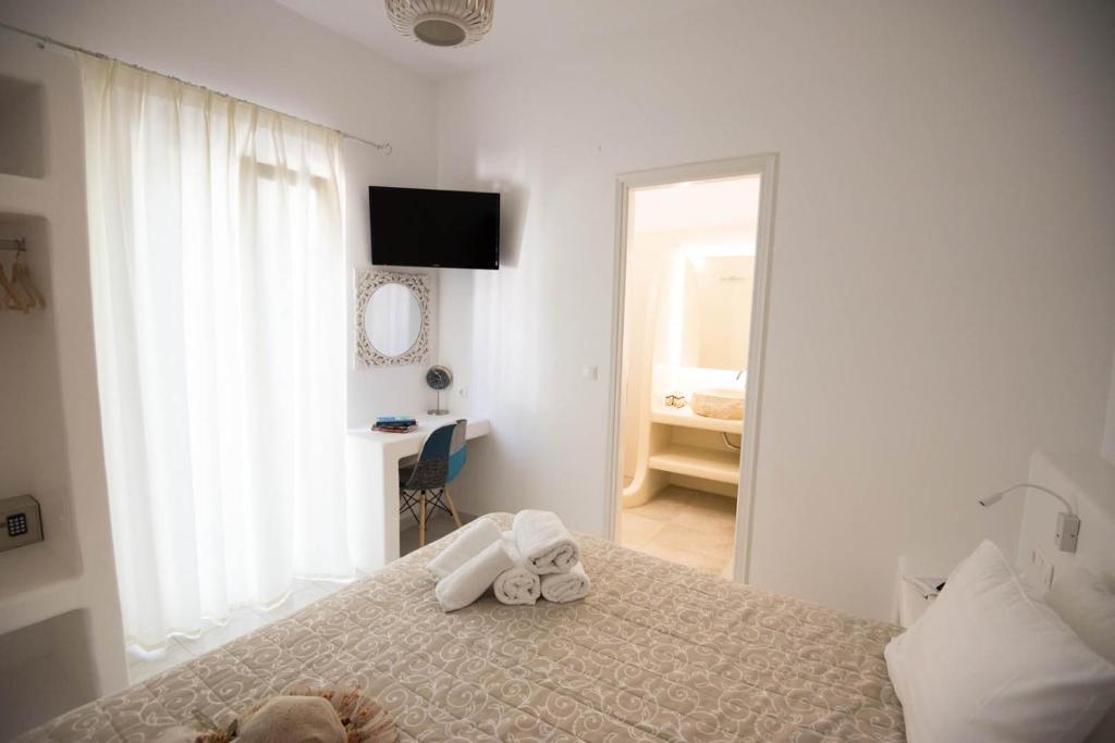 Postel nebo postele na pokoji v ubytování Eleana Studios