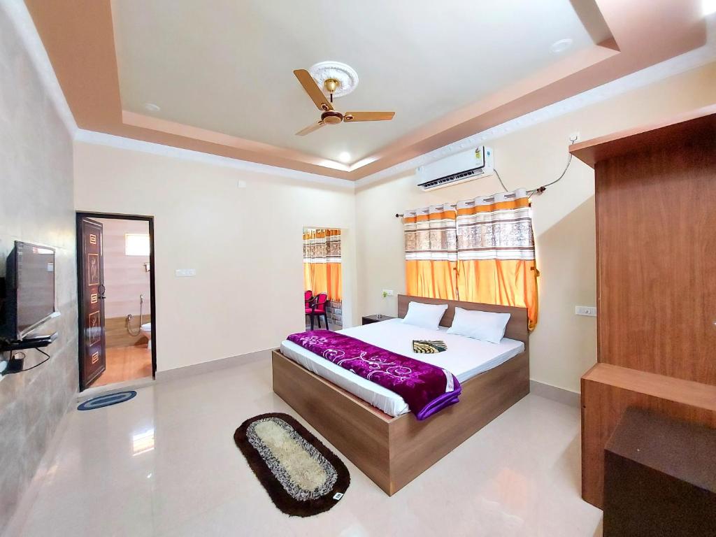 Aappayan Guest House & Restaurant tesisinde bir odada yatak veya yataklar