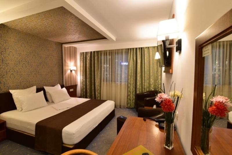 Postel nebo postele na pokoji v ubytování Hotel Forum