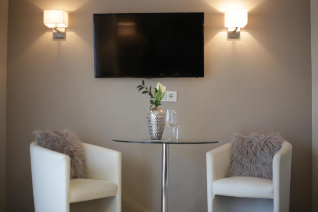 TV a/nebo společenská místnost v ubytování Appart-Hotel REB_ART
