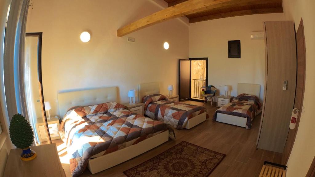 Postel nebo postele na pokoji v ubytování Le Vie di Girgenti