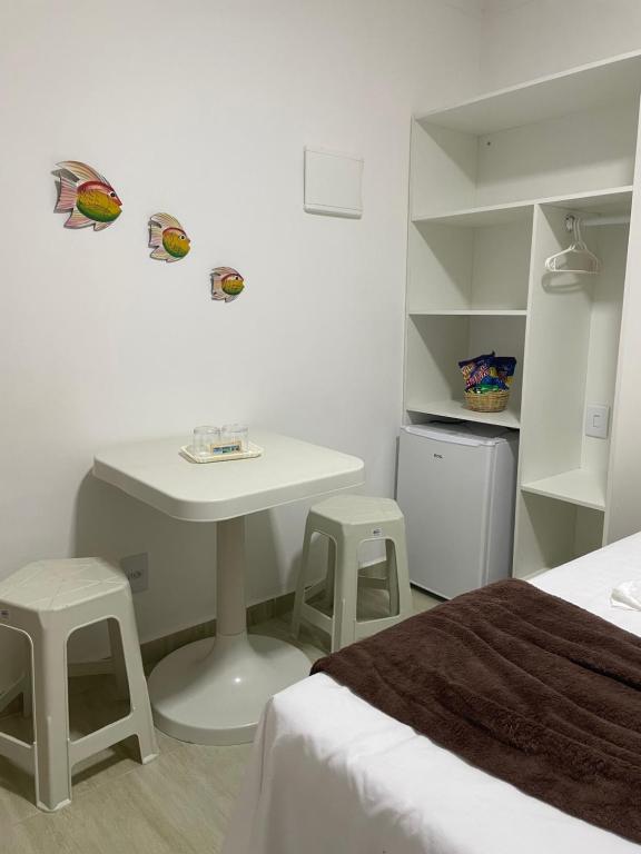 Postel nebo postele na pokoji v ubytování Maragobeach Suits