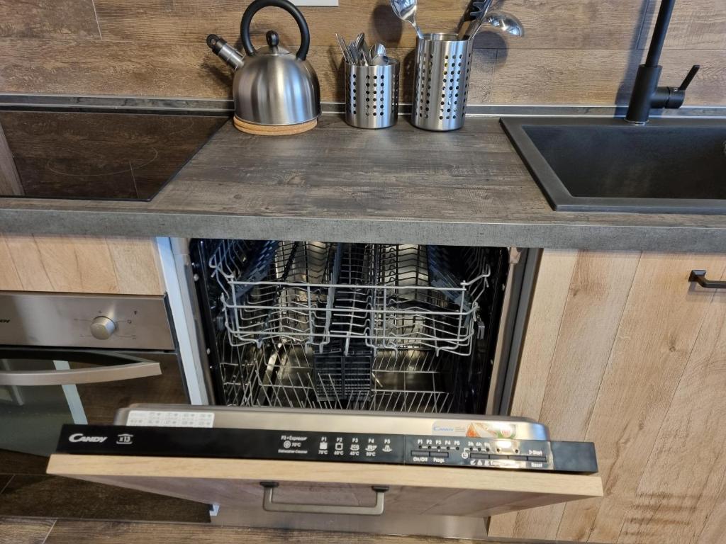 Kuchyňa alebo kuchynka v ubytovaní Moda Apartments Serenella