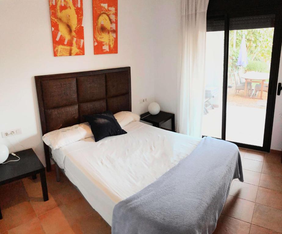 Łóżko lub łóżka w pokoju w obiekcie Casa Indalo - Resort Macenas Mojacar