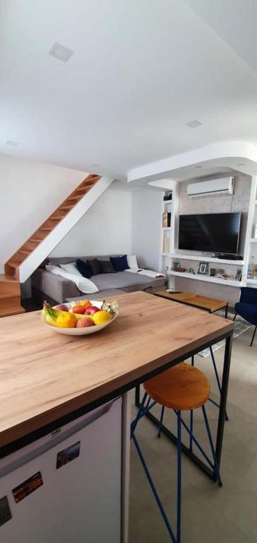 a bowl of fruit on a counter in a kitchen at Sea side apartment in Kotor