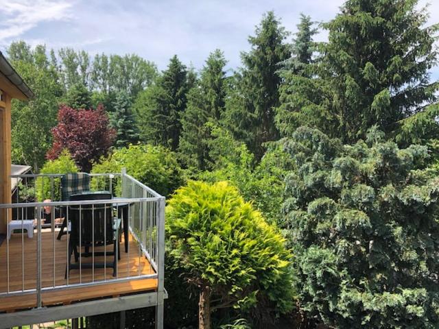 a balcony of a house with trees in the background at Appartement mit Herz in Zeulenroda
