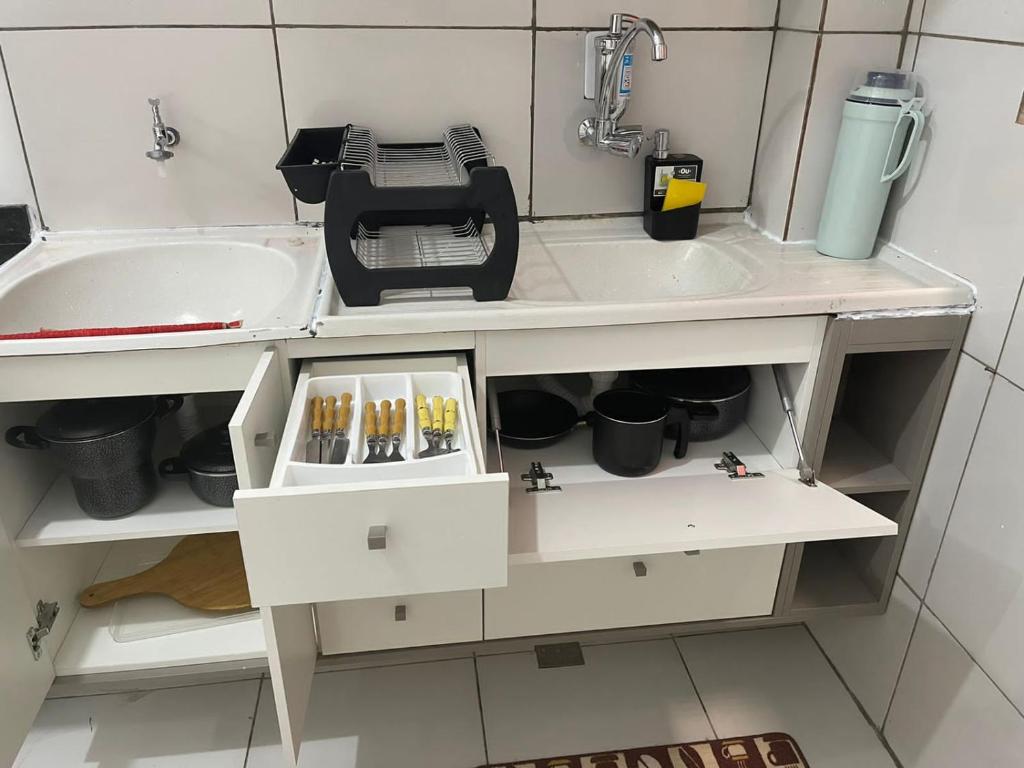 a kitchen with a sink at Flat JK 202 in Juazeiro do Norte