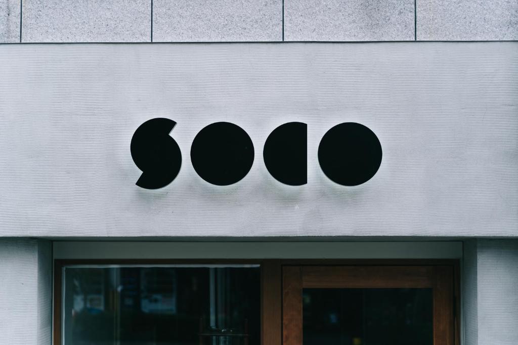 a sign for a store with the word soo on it at soco rooms in Kyoto