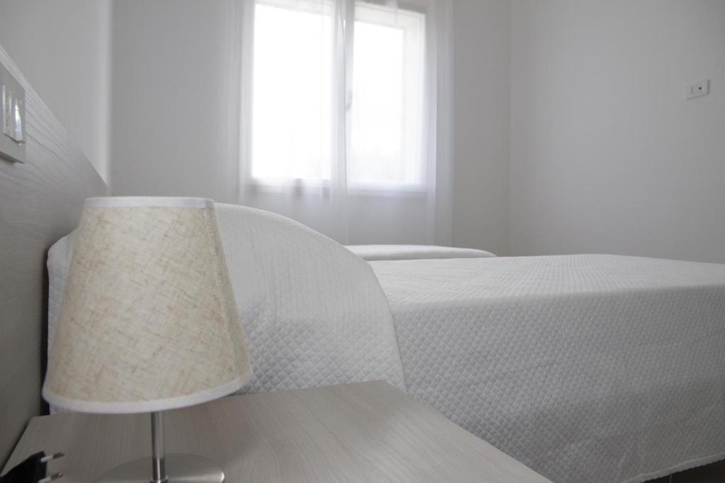Postel nebo postele na pokoji v ubytování Casa Raineri