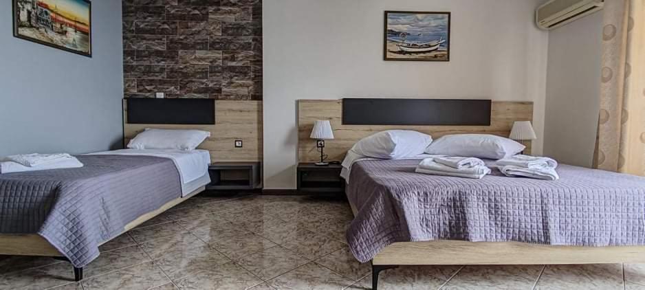 Postel nebo postele na pokoji v ubytování Hotel Klironomi
