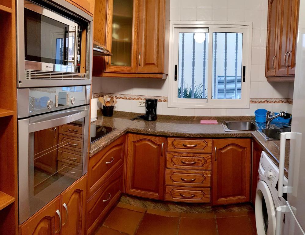 Kuchyň nebo kuchyňský kout v ubytování APARTAMENTO MAYI 2