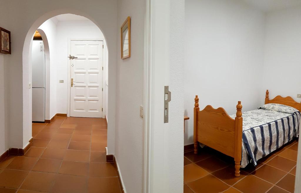 Postel nebo postele na pokoji v ubytování APARTAMENTO MAYI 2