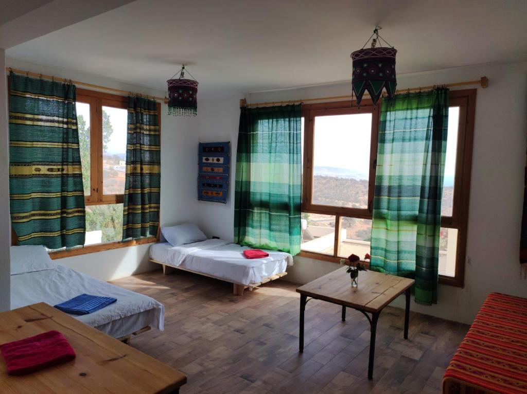 Postel nebo postele na pokoji v ubytování Taghazout Hill Retreat