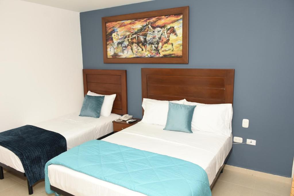 Postel nebo postele na pokoji v ubytování Hotel Kai Soledad Atlántico