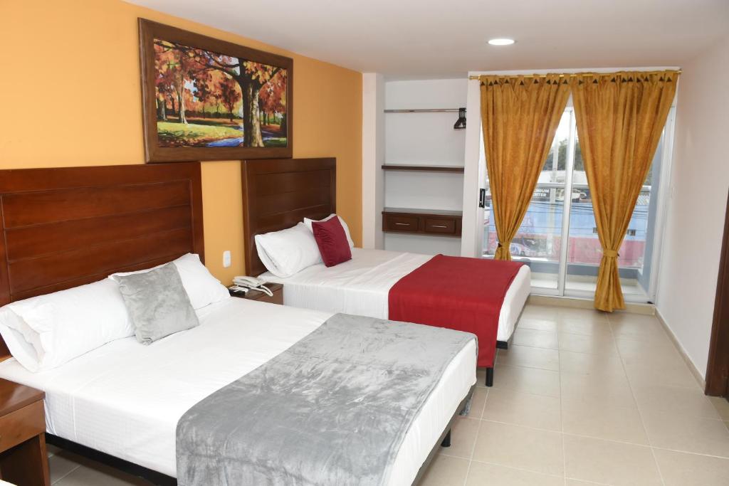 Postel nebo postele na pokoji v ubytování Hotel Kai Soledad Atlántico