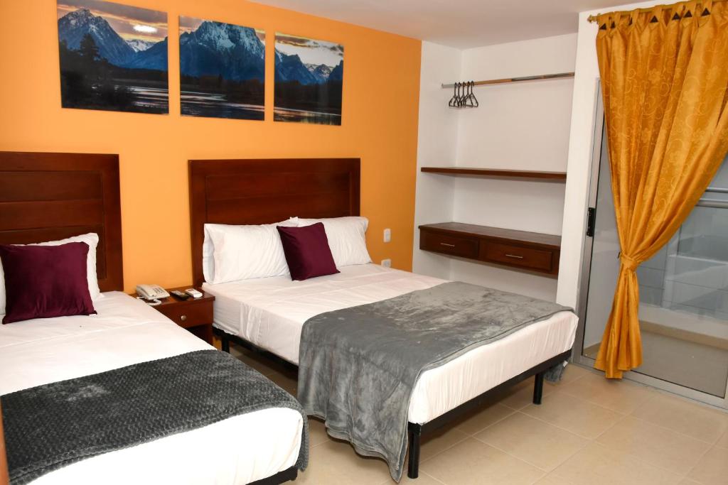 Postel nebo postele na pokoji v ubytování Hotel Kai Soledad Atlántico