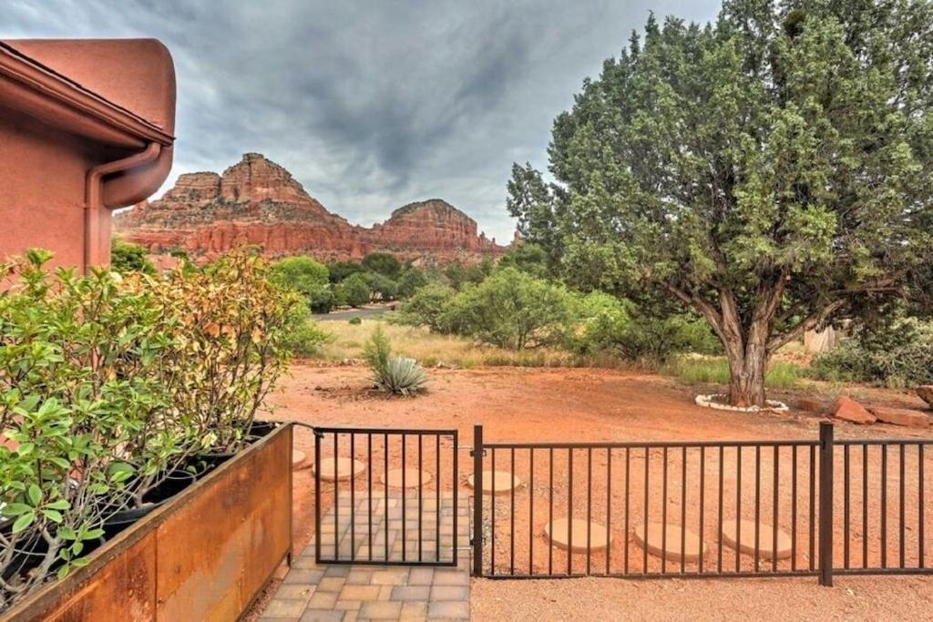 a iron gate with a view of the mountains at Beautiful Sedona Home Near Chapel of the Holy Cross in Sedona