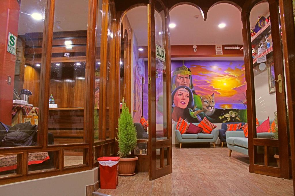 a store lobby with a painting on the wall at Pukara Puka Kantuta in Puno
