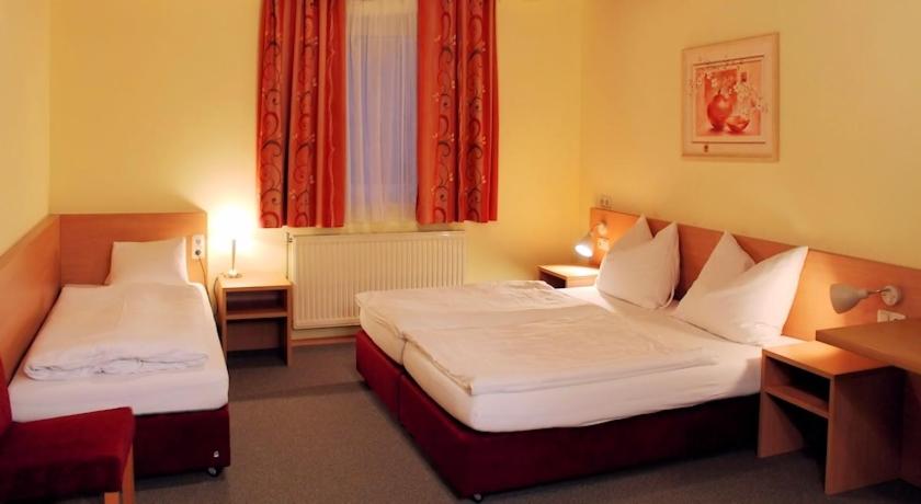 Postel nebo postele na pokoji v ubytování Hotel Denk Bed & Breakfast