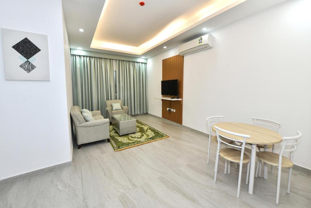 TV a/nebo společenská místnost v ubytování Summit Hotel Suites - القمة للأجنحة الفندقيه