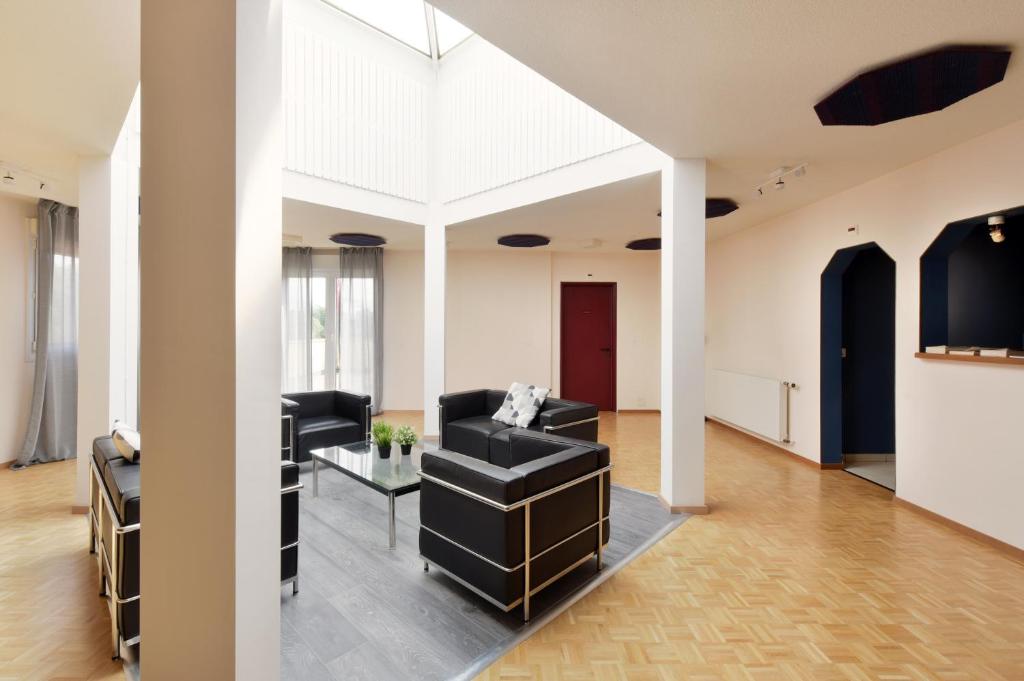 Posezení v ubytování Hôtel des Mosaiques