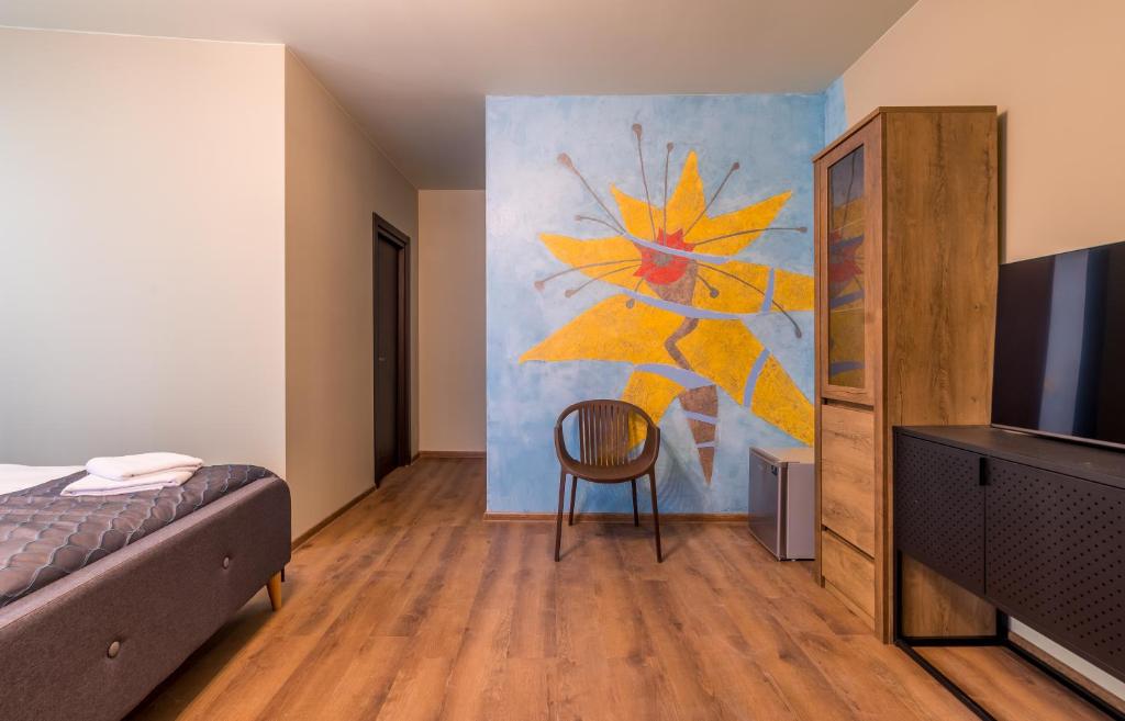 Postel nebo postele na pokoji v ubytování Boutique Kosher Hotel Tourfa