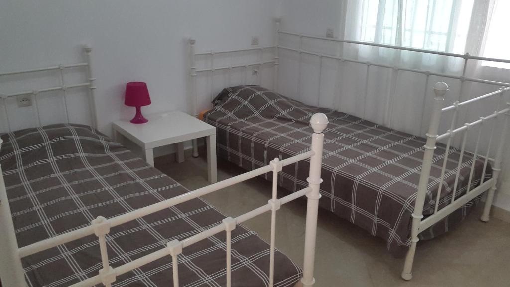 Postel nebo postele na pokoji v ubytování BOUAZIZ