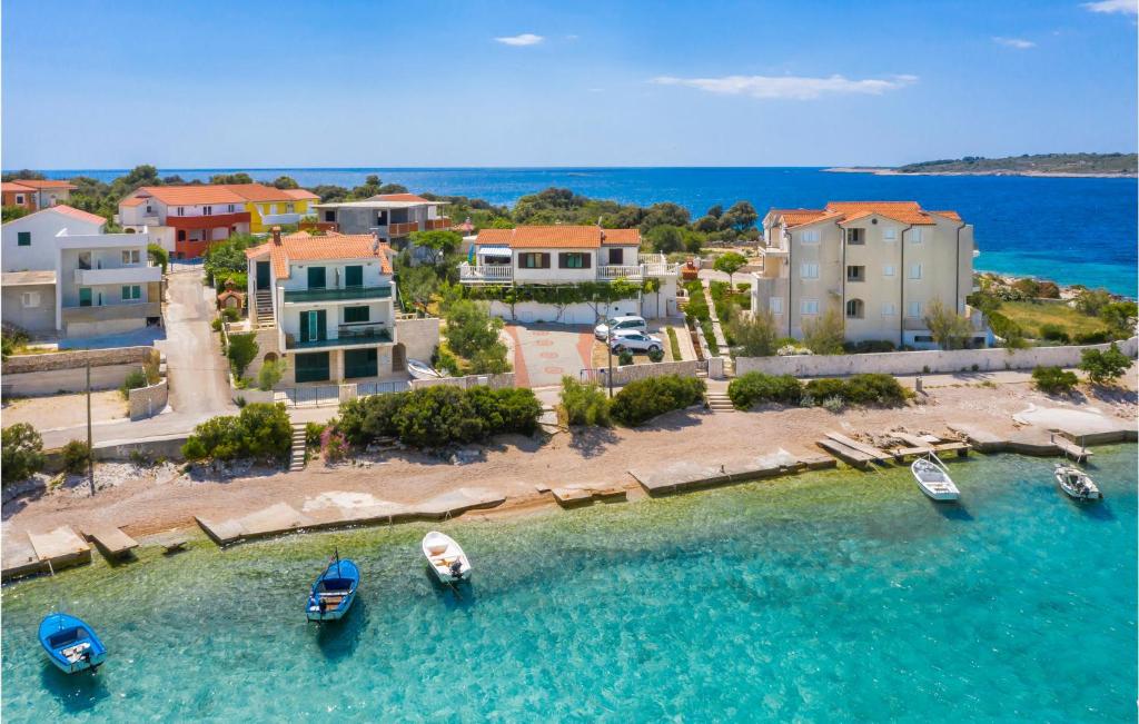 an aerial view of a resort with boats in the water at Stunning Apartment In Rogoznica With House Sea View in Rogoznica