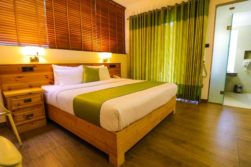 Postel nebo postele na pokoji v ubytování Hotel Ganthera Kandy